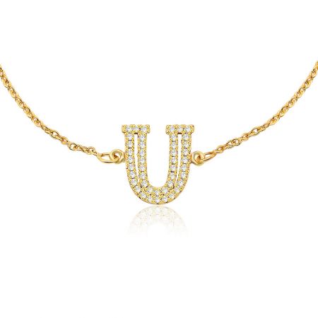 A matching gold U-shaped pendant necklace with cubic zirconia stones.