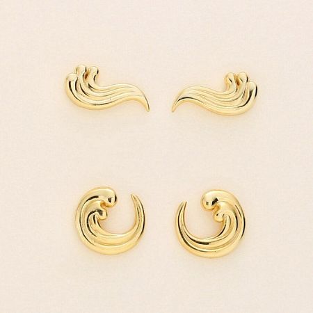 A collection of four gold-plated sterling silver wave stud earrings showcasing different angles.