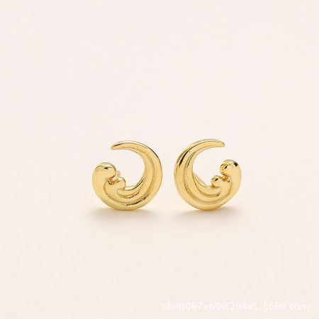 Close-up view of a pair of gold-plated sterling silver earrings with a curly wave design.
