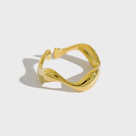 Detailed view of a single 18K gold-plated wavy open ring, highlighting its fluid silhouette.