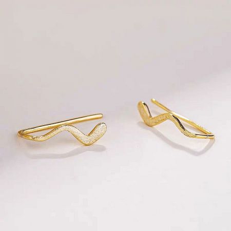 Detailed close-up of the gold 925 sterling silver simple wave stud earrings.