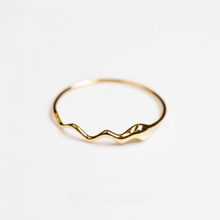 Another angle of the elegant gold wavy ring, showing its unique silhouette.
