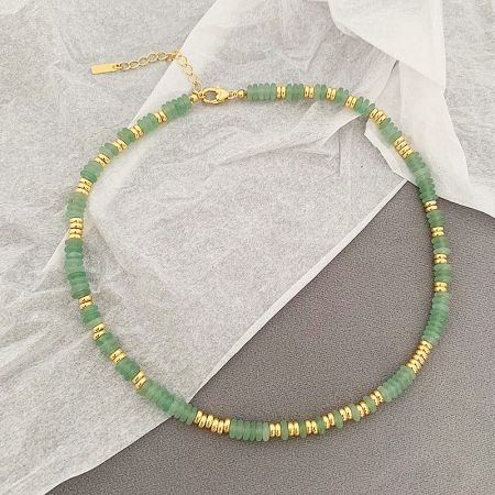 Detailed view of the green natural bead necklace with elegant gold accents.