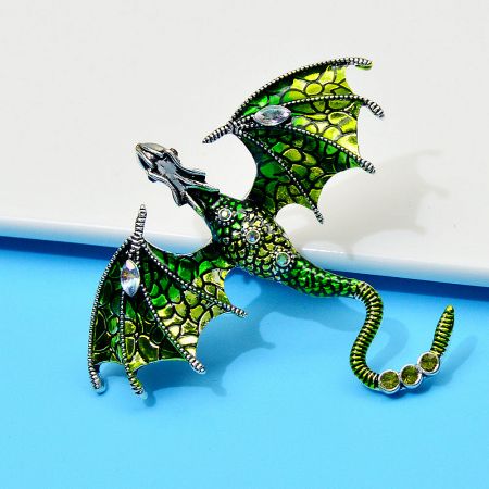 Enamel Painted Rhinestone Dragon Brooch – Fashion Animal Pin in European & American Style - A close-up of the Enamel Painted Rhinestone Dragon Brooch, showing its intricate green mosaic design and sparkling gemstone embellishments.