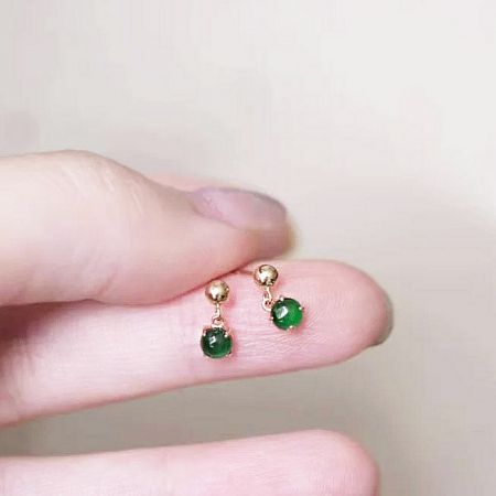 Another angle of the elegant tiny jade earrings, emphasizing the lustrous gold plating on sterling silver.