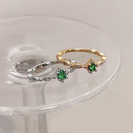 Artistic shot of the silver and gold rings highlighting the decorative bands.