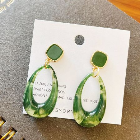 The green vintage drop earrings displayed on a JR Fashion Accessories branded card.