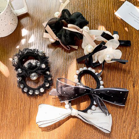 Vintage Style Lace Bowknot Elastic Hair Tie Bands (Set of 5) - A collection of vintage-style hair accessories, including black and white lace bowknot hair ties and scrunchies embellished with elegant pearls and ribbons.