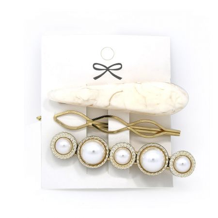 Alternative view of the hair clip set, featuring a marble-effect clip, an infinity twist clip, and a pearl clip.