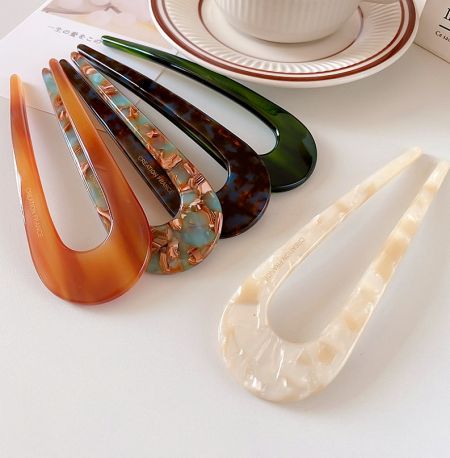 Assortment of U-shaped French style hair clips in different colors and patterns, model JRA-042.
