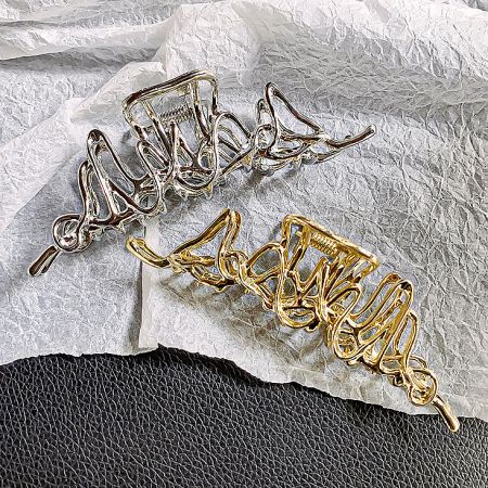 Side-by-side comparison of the silver and gold geometric hair clips.