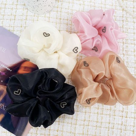 Women's Heart Charm Silk Elastic Scrunchies Hair Tie Bands (Set of 5) - A set of four colorful silk elastic scrunchies, each adorned with a delicate heart charm, displayed on a neutral background. Part of the JR Fashion Accessories hair tie collection.