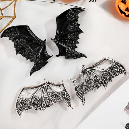 Multiple matte black bat wing hair clips displayed, highlighting their versatile use as gothic accessories.