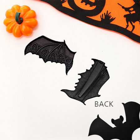 Front and back view of the bat wing hair clips, demonstrating their construction and clip mechanism.