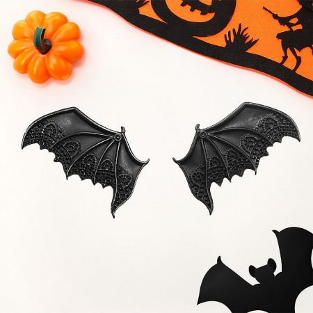 A single matte black bat wing hair clip shown against a neutral background to emphasize its design.