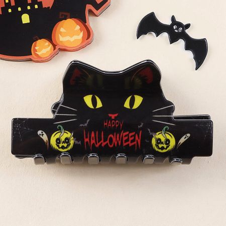 A spooky black cat Halloween hair clip.