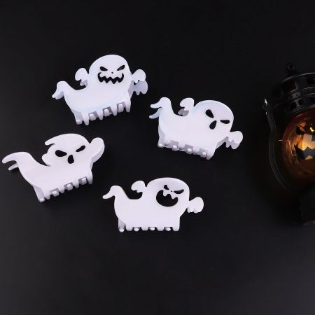 A set of spooky ghost-shaped hair clips for Halloween.