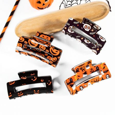 A collection of Halloween-themed claw clips featuring ghosts, pumpkins, and other spooky designs.