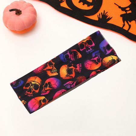 Vibrant Halloween headband with a pattern of colorful skulls on a black background.