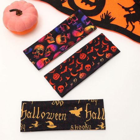 A black headband featuring a repeating white skull pattern for Halloween.