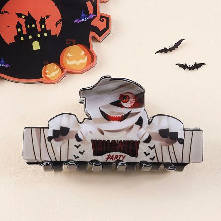 Close-up of a mummy-themed Halloween hair clip.