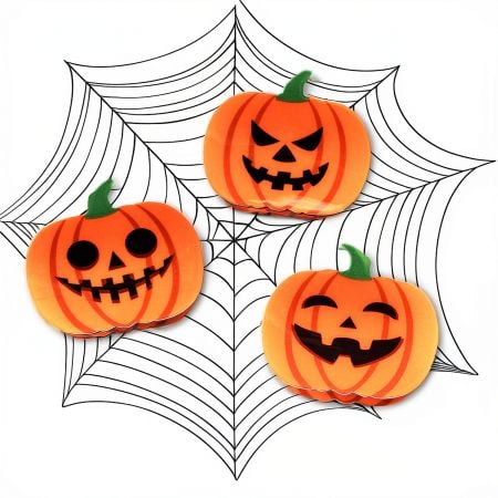 Another angle of the pumpkin hair clip, highlighting its glossy finish and vibrant color.