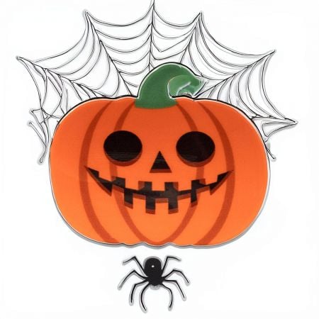 Detailed view of the pumpkin hair clip's design and vibrant orange color.