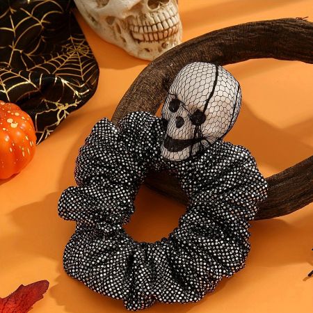 Detailed view of the 3D skull embellishment on the Halloween hair tie.
