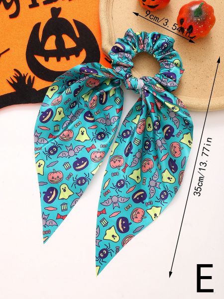 A teal Halloween scrunchie with various icons and a long ribbon tail.