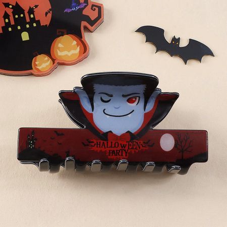 A fun vampire-themed hair clip with fangs and a cape.