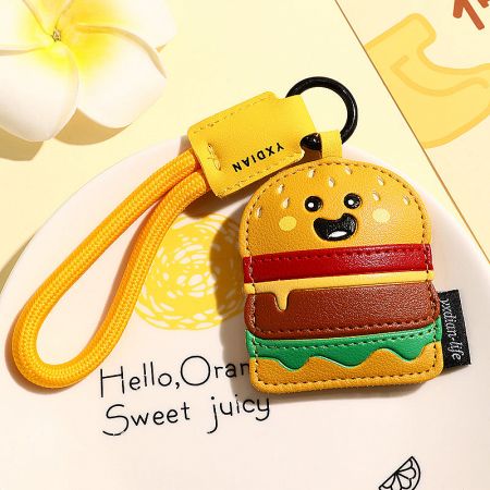 The hamburger-shaped PU leather keychain, showing its layered design and quality stitching.