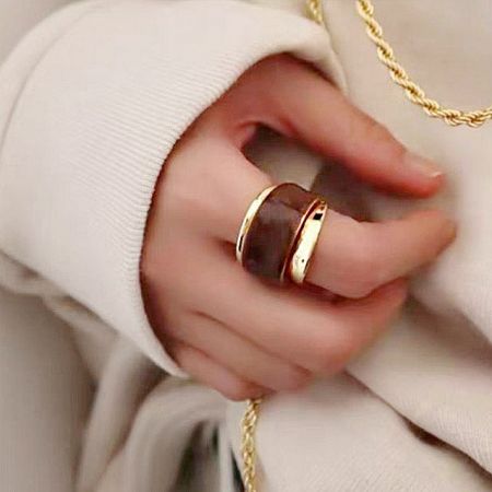 Brass Dual-Layered Chocolate Enamel Chunky Band Cuff Rings Set of 5 - A close-up of a hand wearing two brass cuff rings with a chunky, dual-layered chocolate enamel design, part of a stylish set of five.