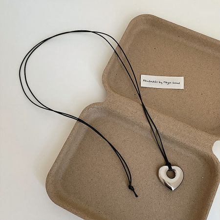 The heart-shaped pendant variation, showcasing its simple and elegant design.