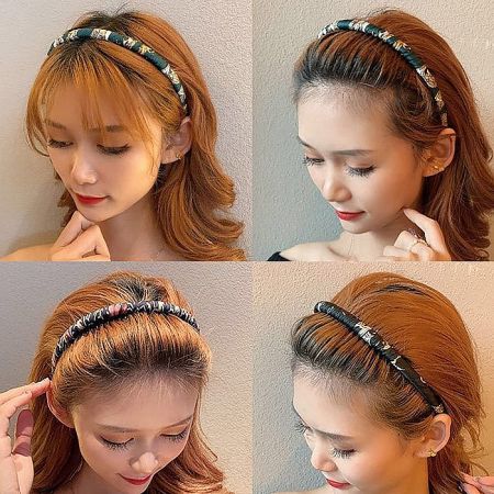 Model demonstrating how to style hair with a fabric-wrapped headband for a chic look.