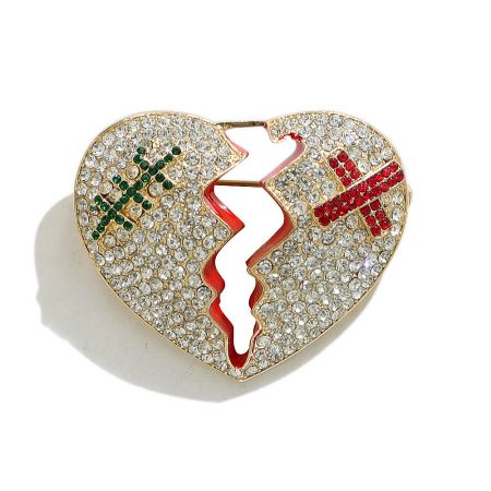 Alternative design view of the heart-shaped brooch featuring band-aid motifs over the crack.