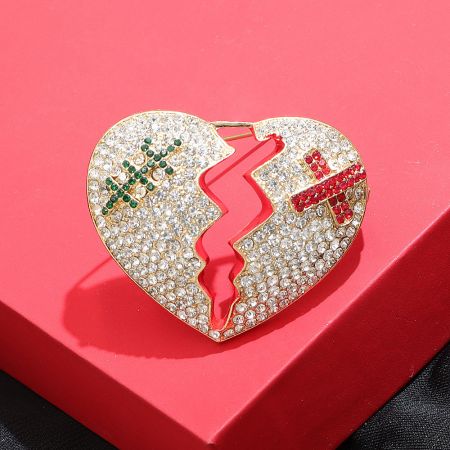 Rhinestone Cracked Heart Brooch – Fashion Statement Pin (5 pcs) - Front view of the Rhinestone Cracked Heart Brooch, showcasing its gold-colored alloy, broken heart design, and full encrusting of clear rhinestones with subtle red and green accents.