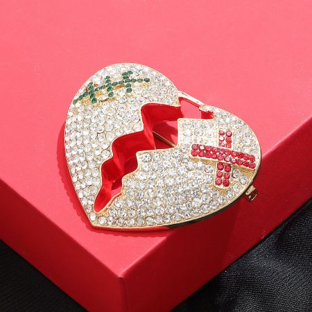 Detailed close-up of the Rhinestone Cracked Heart Brooch highlighting the sparkling rhinestones.
