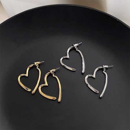 Simple Design Geometric Heart Drop Earrings (5 Pairs) - A pair of gold and a pair of silver simple geometric heart drop earrings elegantly displayed on a black surface, showcasing the two available color options.