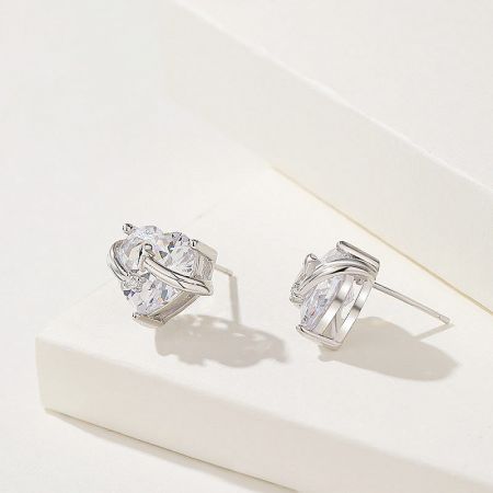 Another angle of the heart-shaped earrings in their silver setting.