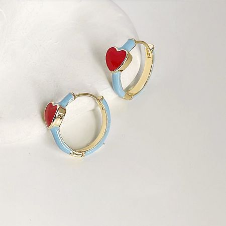 14k Gold Plated Red Enamel Heart Huggie Hoop Earrings (5 pairs) - A pair of 14k gold plated huggie hoop earrings with light blue enamel bands and a vibrant red enamel heart at the top, shown against a white background.