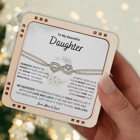 The infinity heart bracelet presented with a heartfelt message card, an ideal graduation gift for a daughter.