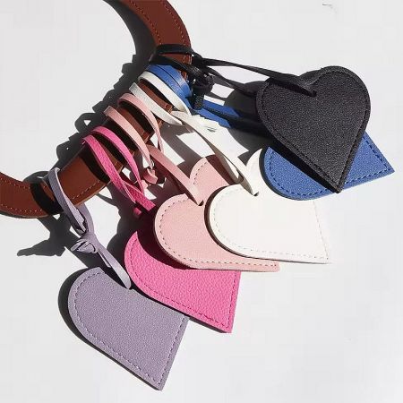 A collection of colorful heart-shaped PU leather bag charms available for custom orders.
