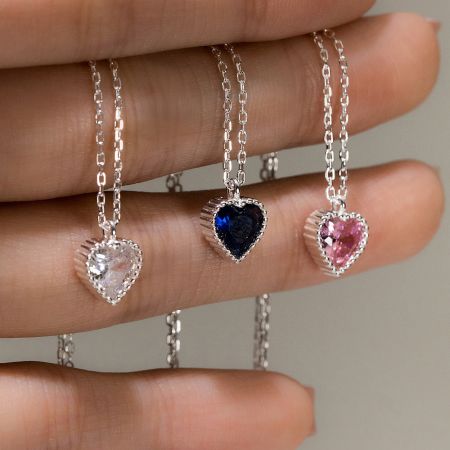 925 Sterling Silver Minimalist Sparkling Heart Pendant Necklace set of 5 - A collection of three 925 sterling silver minimalist heart pendant necklaces with sparkling clear, blue, and pink gemstones.