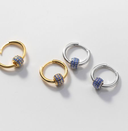 925 Sterling Silver Round Hoop Earrings - Elegant 925 sterling silver round hoop earrings with blue and clear cubic zirconia clusters, shown in both gold and rhodium plating.