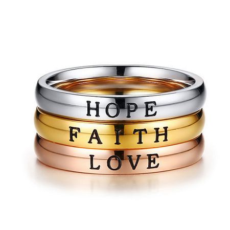 Three silver rings engraved with 'Hope', 'Faith', and 'Love'