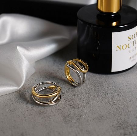 Lifestyle shot of the stainless steel cross ring, showcasing its elegant design.