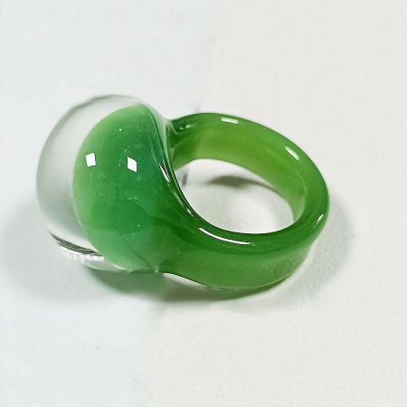 Close-up of the green jade-like glass ring with a clear dome top.