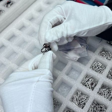 Precision assembly and inspection of custom earrings in the JR Fashion Accessories production line.