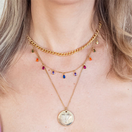 A stylish look featuring the layered rainbow gemstone necklace.