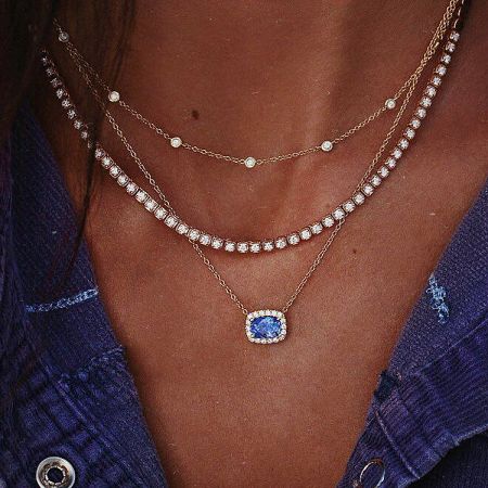 Full view of the layered necklace set, highlighting the different pendant styles.